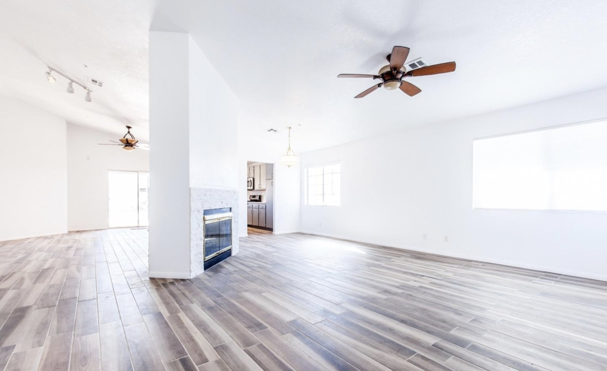 Before: unfurnished living room with tile floors